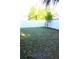 Well-maintained backyard with a white fence, offering privacy and space for outdoor activities at 2211 E 28Th Ave, Tampa, FL 33605