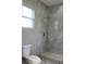 Bathroom featuring marble tiled shower and rainfall shower head at 2211 E 28Th Ave, Tampa, FL 33605