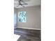 Light-filled bedroom with hard surface flooring and a window providing natural light at 2211 E 28Th Ave, Tampa, FL 33605