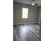 Well-lit bedroom with hard surface flooring, window and ceiling fan at 2211 E 28Th Ave, Tampa, FL 33605