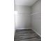 Walk-in closet with installed wire rack shelves and gray wood-look flooring at 2211 E 28Th Ave, Tampa, FL 33605
