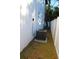 Side yard featuring a white fence and an air conditioning unit next to a modern two-story home at 2211 E 28Th Ave, Tampa, FL 33605