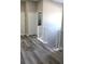 Hallway with view of staircase and doors, with luxury vinyl plank flooring at 2211 E 28Th Ave, Tampa, FL 33605