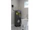 Laundry room featuring a sink and water heater at 2211 E 28Th Ave, Tampa, FL 33605