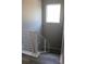 Staircase with modern, white railing with window at the top of the stairs at 2211 E 28Th Ave, Tampa, FL 33605