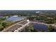 Aerial view of a residential community near bodies of water surrounded by trees and lush vegetation at 23231 Scaglione Dr, Lutz, FL 33549