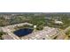 Picturesque aerial shot of a community near a pond, surrounded by greenery, showcasing a tranquil suburban setting at 23231 Scaglione Dr, Lutz, FL 33549