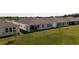 A generously sized, well-maintained backyard with a covered patio and verdant lawn, ideal for entertainment at 23231 Scaglione Dr, Lutz, FL 33549