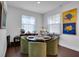 Cozy breakfast nook with seating for four, natural light, and contemporary decor at 23231 Scaglione Dr, Lutz, FL 33549