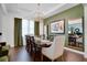 Elegant dining room featuring a chandelier, table for eight, and stylish decor at 23231 Scaglione Dr, Lutz, FL 33549
