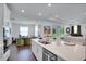 Modern kitchen with large island, stainless steel appliances, and open to the living area at 23231 Scaglione Dr, Lutz, FL 33549