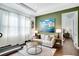 A cozy living room features modern decor, hardwood floors, and access to a bedroom at 23231 Scaglione Dr, Lutz, FL 33549