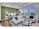 Inviting bedroom with a seating area, a view of the lake, and elegant decor and furnishings at 23231 Scaglione Dr, Lutz, FL 33549