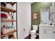 Chic powder room with decorative shelving, stylish mirror, and modern fixtures, providing a touch of elegance at 23231 Scaglione Dr, Lutz, FL 33549