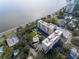 Aerial view showcases condos near waterfront, a community pool, and ample parking at 2401 S Ardson Pl # 503, Tampa, FL 33629