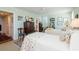Bright bedroom featuring two beds, classic wooden furniture, and plenty of natural light at 2401 S Ardson Pl # 503, Tampa, FL 33629