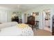 Bright bedroom featuring two twin beds, classic wooden furniture, and an en-suite bathroom at 2401 S Ardson Pl # 503, Tampa, FL 33629