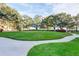 A vast lawn has beautiful oak trees and a sidewalk for resident enjoyment at 2401 S Ardson Pl # 503, Tampa, FL 33629