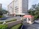 High-rise building with a gated entrance and covered parking for tenants and guests at 2401 S Ardson Pl # 503, Tampa, FL 33629