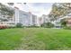 Building exterior surrounded by mature trees, shrubs and manicured lawn at 2401 S Ardson Pl # 503, Tampa, FL 33629