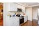 Bright kitchen featuring stainless steel appliances and crisp white cabinets at 2401 S Ardson Pl # 503, Tampa, FL 33629