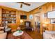 Living room boasting wood paneled walls, built-in shelving, and comfortable seating at 2401 S Ardson Pl # 503, Tampa, FL 33629