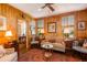 Cozy living room with wood-paneled walls, plush seating, and an elegant area rug at 2401 S Ardson Pl # 503, Tampa, FL 33629