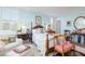 Serene main bedroom featuring blue walls, natural light, a four-poster bed, and stylish furniture at 2401 S Ardson Pl # 503, Tampa, FL 33629
