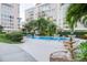 Community pool with lounge chairs and tables for outdoor enjoyment and relaxation at 2401 S Ardson Pl # 503, Tampa, FL 33629