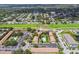 Aerial view highlighting multiple community pools, lush green spaces, and ample parking at 2500 Harn Blvd # B11, Clearwater, FL 33764