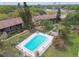 Aerial view of apartments with a community pool and well-maintained landscaping at 2500 Harn Blvd # B11, Clearwater, FL 33764