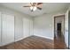 Bedroom featuring wooden floors, ceiling fan, and closet with sliding doors at 2500 Harn Blvd # B11, Clearwater, FL 33764
