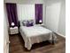 Inviting bedroom with stylish decor, including purple accents and sleek modern lighting at 2500 Harn Blvd # B11, Clearwater, FL 33764