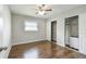 Bedroom featuring wooden floors, ceiling fan, and closet with sliding doors at 2500 Harn Blvd # B11, Clearwater, FL 33764