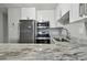 Updated kitchen featuring stainless steel appliances, granite countertops, and white cabinets at 2500 Harn Blvd # B11, Clearwater, FL 33764