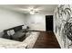Cozy living room featuring a large sectional sofa, stylish rug, and botanical wall art at 2500 Harn Blvd # B11, Clearwater, FL 33764