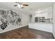 Bright and airy living area with wood floors and a modern kitchen view, perfect for entertaining at 2500 Harn Blvd # B11, Clearwater, FL 33764