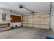 Spacious garage with ample storage and a work bench for projects and organization at 2692 Royal Ridge Dr, Spring Hill, FL 34606