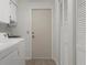Functional laundry room featuring modern appliances and ample storage space at 2692 Royal Ridge Dr, Spring Hill, FL 34606