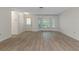 Bright living space with wood flooring, large windows and a side entrance at 2692 Royal Ridge Dr, Spring Hill, FL 34606