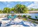 Private backyard featuring a patio set and lush landscaping for outdoor enjoyment at 2700 56Th S St, Gulfport, FL 33707