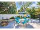 Outdoor patio with a fire pit and a table with seating for six at 2700 56Th S St, Gulfport, FL 33707