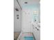 Clean bathroom with a walk-in shower, white cabinets, and beachy accents at 2700 56Th S St, Gulfport, FL 33707
