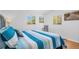 Bright bedroom with calming decor, ample natural light and wood look floors at 2700 56Th S St, Gulfport, FL 33707
