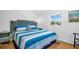 Comfortable bedroom with a decorative headboard, side table, and natural light at 2700 56Th S St, Gulfport, FL 33707