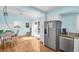 Bright dining area with stainless steel refrigerator and sliding door access to the backyard patio at 2700 56Th S St, Gulfport, FL 33707