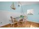 Charming dining room with stylish table setting, nautical decor, and a cozy atmosphere for Gathering gatherings at 2700 56Th S St, Gulfport, FL 33707
