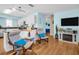 Bright, open living room with hardwood floors, beachy decor, and a seamless flow into the modern kitchen at 2700 56Th S St, Gulfport, FL 33707