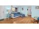 Cozy living room featuring a plush sofa, wooden floors, and bright natural light, creating a comfortable atmosphere at 2700 56Th S St, Gulfport, FL 33707