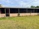 Large screened-in porch overlooking the backyard, perfect for relaxing outdoors at 3005 W 18Th W Ave, Bradenton, FL 34205